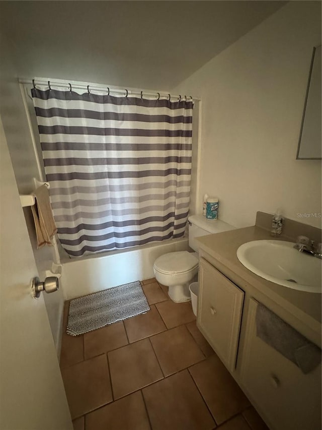 full bathroom with tile patterned flooring, vanity, toilet, and shower / bathtub combination with curtain