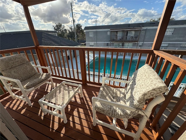 wooden terrace with a water view