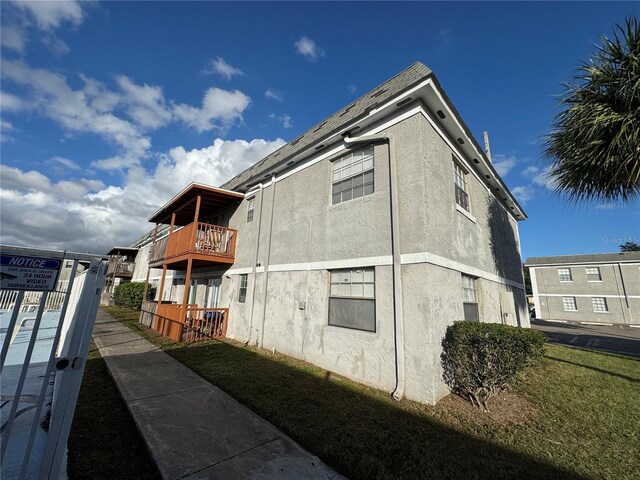 view of property exterior featuring a balcony