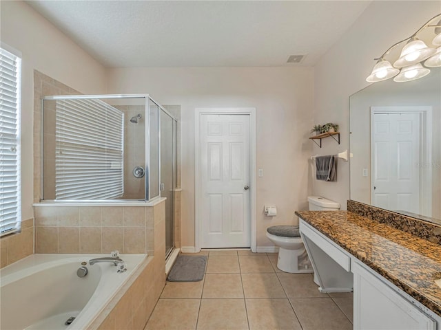 full bathroom with toilet, tile patterned floors, independent shower and bath, vanity, and plenty of natural light