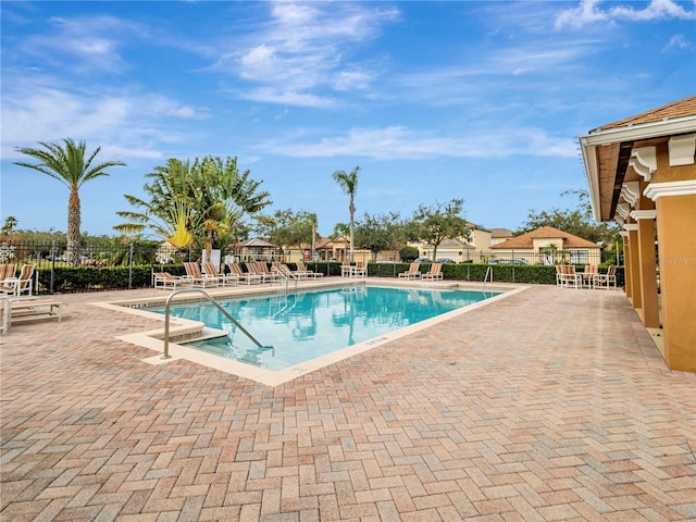 view of swimming pool with a patio