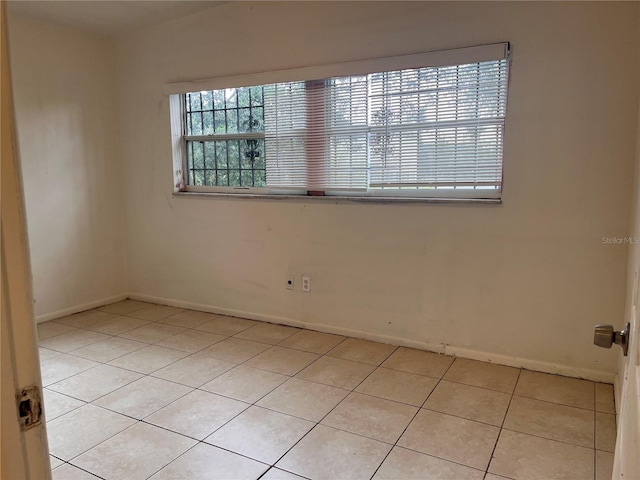 view of tiled spare room