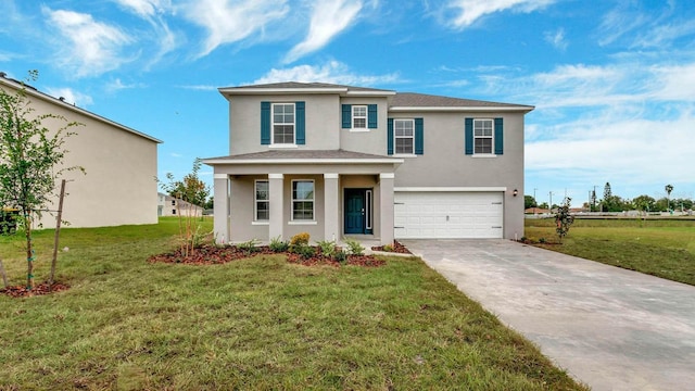 view of front of property with a front yard and a garage