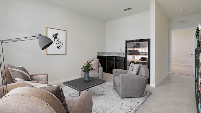 living room featuring light tile patterned flooring and sink