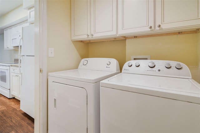 washroom featuring dark hardwood / wood-style floors and independent washer and dryer