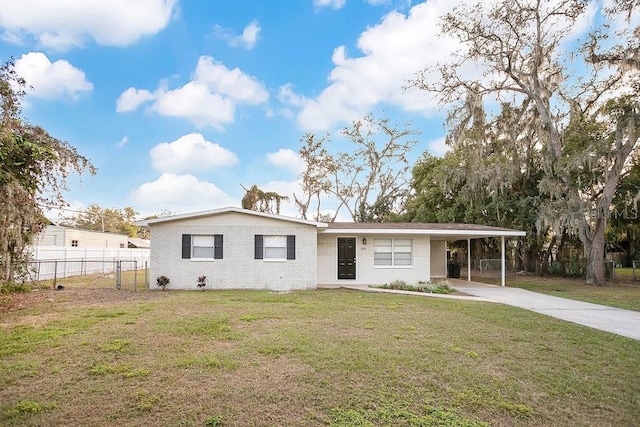 view of front of house with a front lawn and a carport