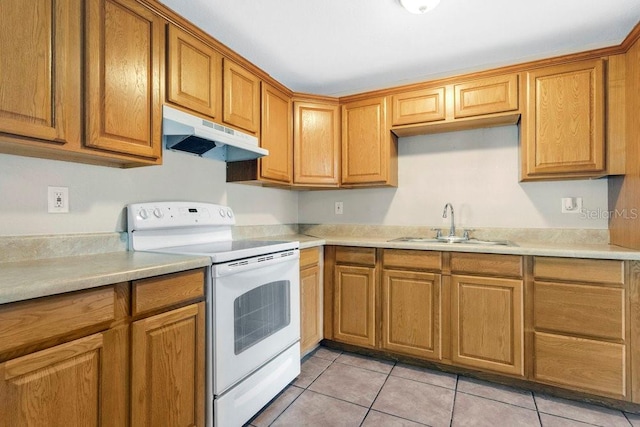 kitchen featuring sink, light tile patterned flooring, and white electric stove