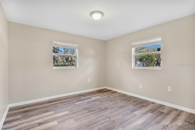 spare room featuring light hardwood / wood-style flooring