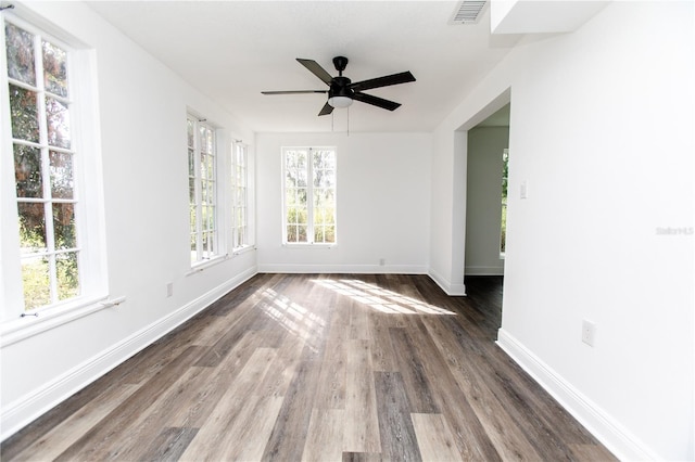 spare room featuring dark hardwood / wood-style floors and ceiling fan