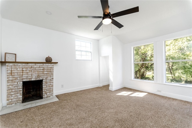 unfurnished living room with carpet, ceiling fan, plenty of natural light, and vaulted ceiling