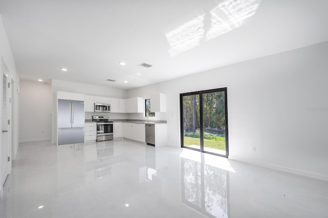 kitchen featuring visible vents, recessed lighting, appliances with stainless steel finishes, white cabinets, and modern cabinets