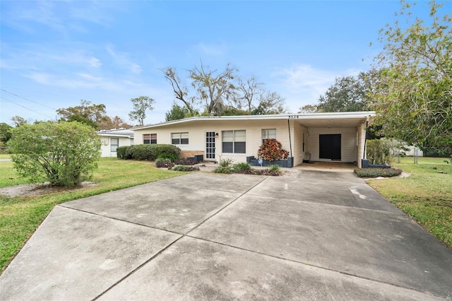 single story home with a front lawn and a carport