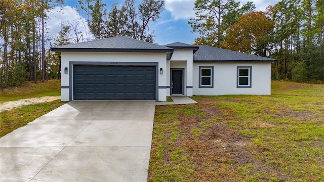 view of front facade featuring a garage and a front lawn