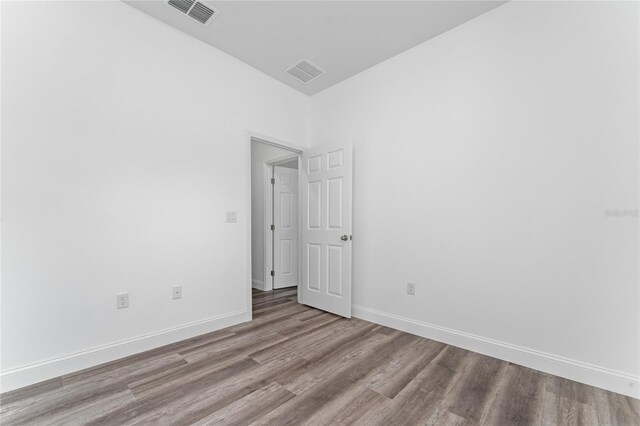 unfurnished room featuring light hardwood / wood-style floors