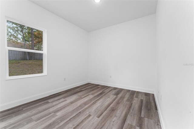 spare room with light hardwood / wood-style flooring