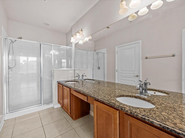 bathroom featuring vanity, tile patterned floors, and walk in shower