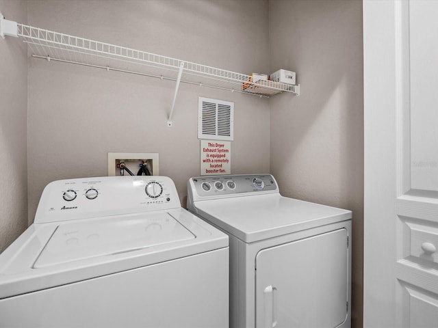 laundry room featuring washing machine and dryer