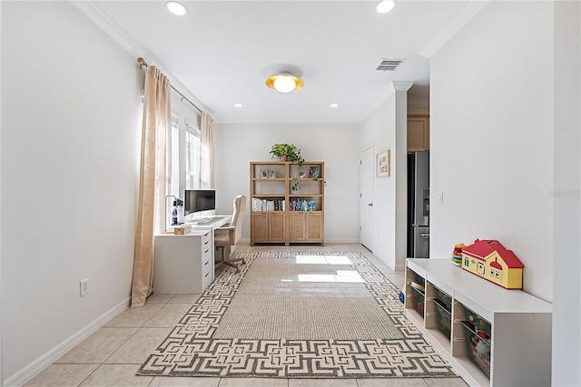 hall with ornamental molding and light tile patterned flooring