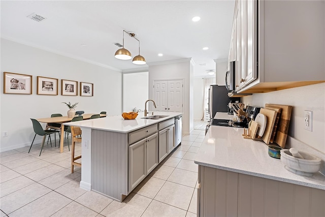 kitchen featuring gray cabinetry, sink, stainless steel appliances, pendant lighting, and light tile patterned flooring