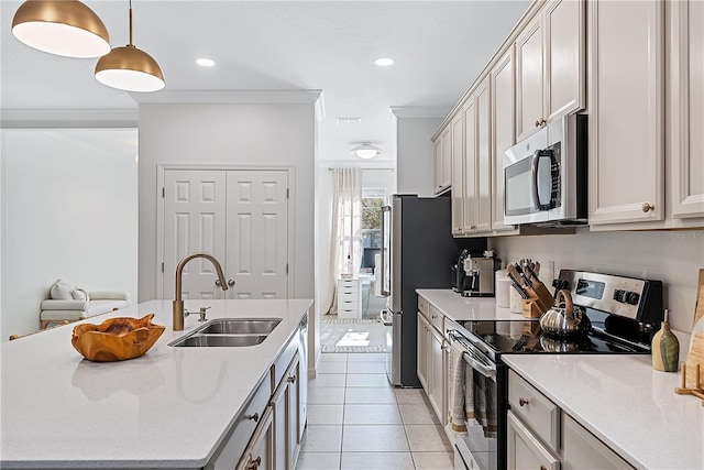 kitchen with sink, hanging light fixtures, crown molding, light tile patterned floors, and appliances with stainless steel finishes