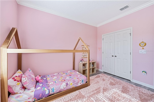 bedroom featuring wood-type flooring and crown molding