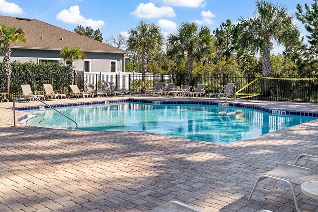 view of swimming pool with a patio area