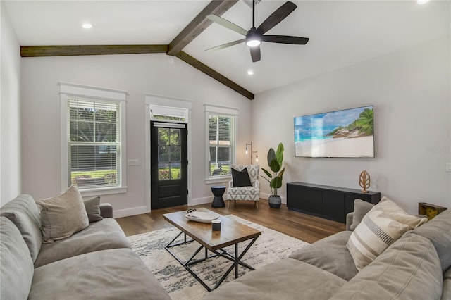 living room featuring ceiling fan, dark hardwood / wood-style flooring, and lofted ceiling with beams