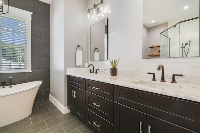 bathroom with vanity and plus walk in shower