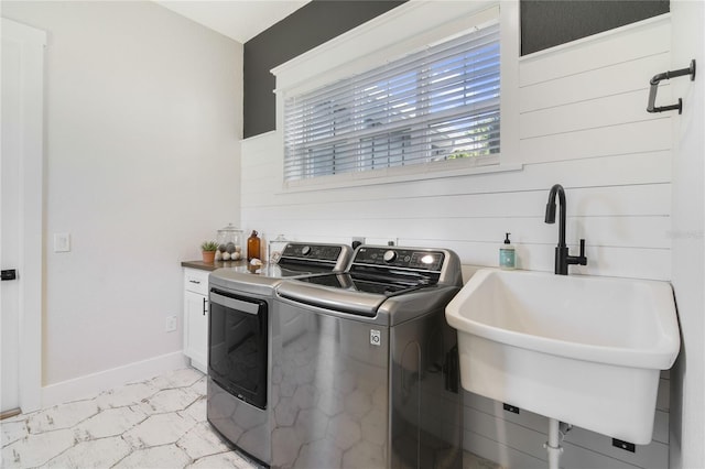 washroom featuring washer and clothes dryer and sink