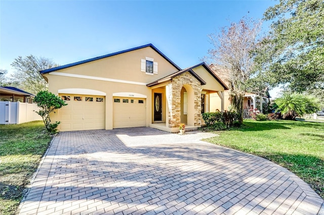 view of front of property featuring a garage and a front lawn