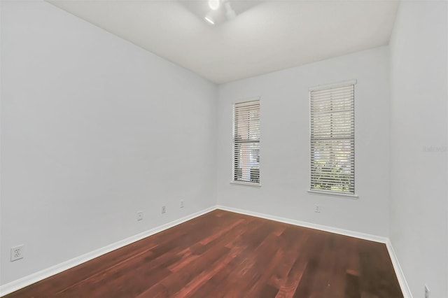 spare room with wood-type flooring