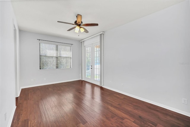 spare room with french doors, ceiling fan, and dark hardwood / wood-style floors