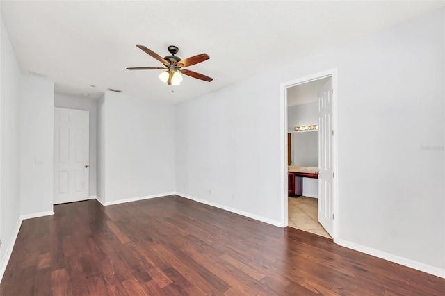 spare room with ceiling fan and hardwood / wood-style floors