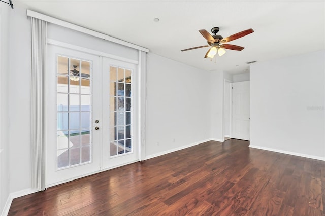 empty room featuring ceiling fan, dark hardwood / wood-style flooring, and french doors