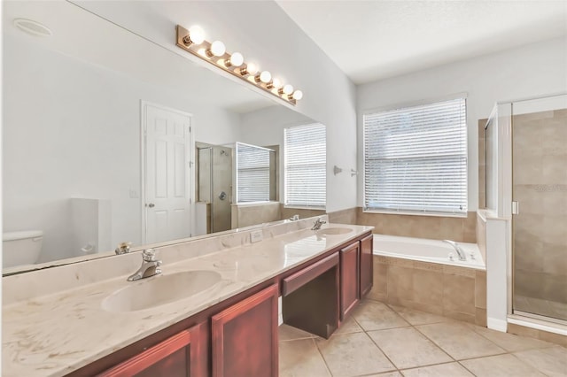 full bathroom featuring toilet, vanity, tile patterned floors, and plus walk in shower