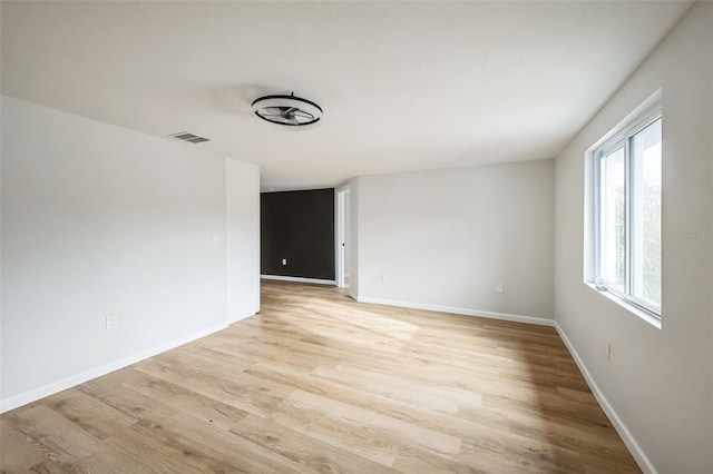 empty room with light wood-type flooring