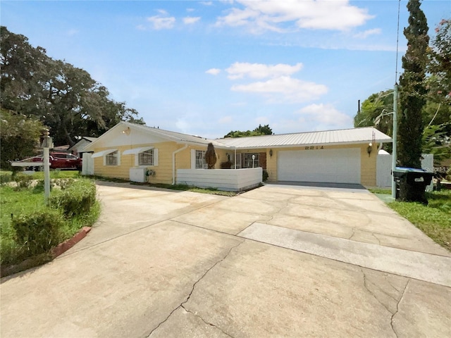 ranch-style home featuring a garage