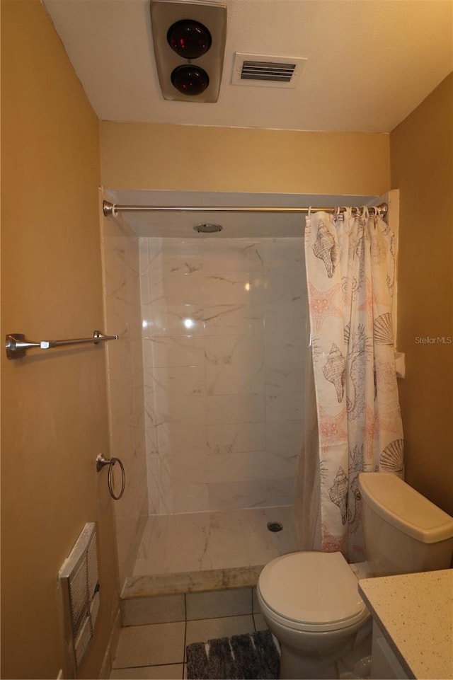 bathroom featuring tile patterned floors, vanity, toilet, and a shower with curtain