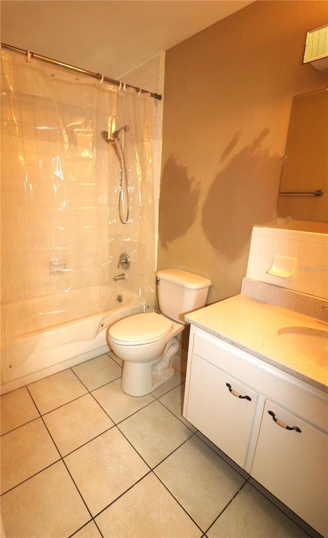 full bathroom with toilet, vanity, tile patterned floors, and shower / bath combo with shower curtain