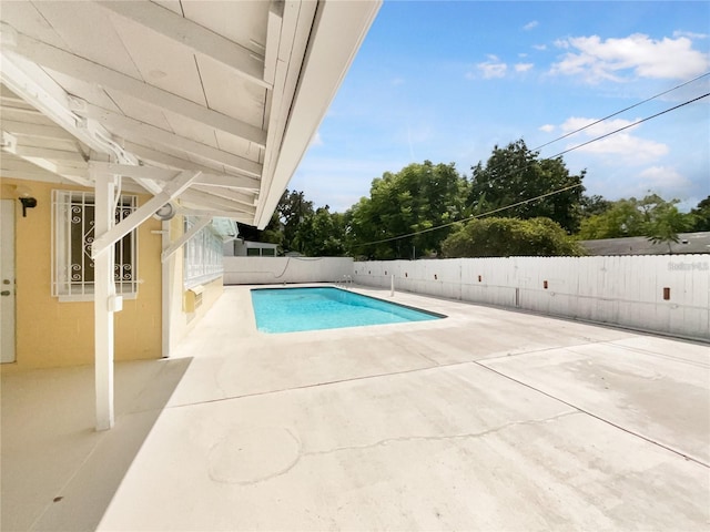 view of pool featuring a patio