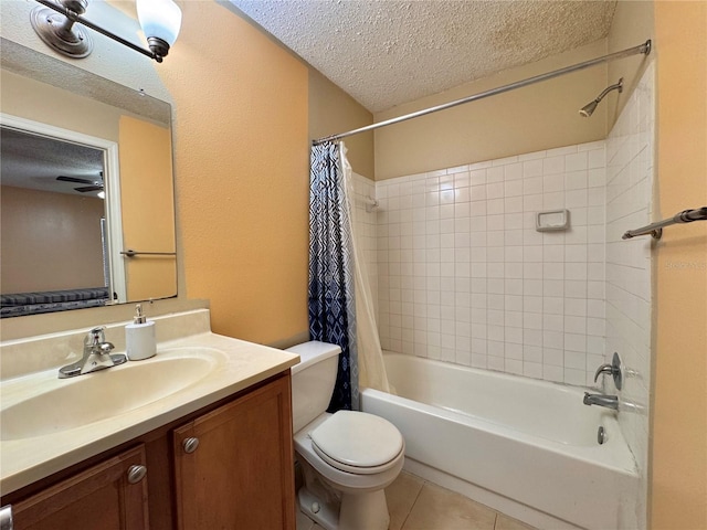 full bathroom featuring vanity, tile patterned flooring, toilet, a textured ceiling, and shower / tub combo