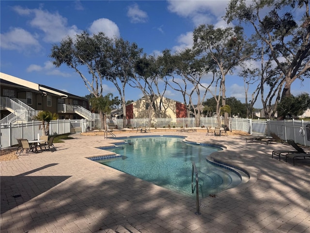 view of swimming pool featuring a patio area