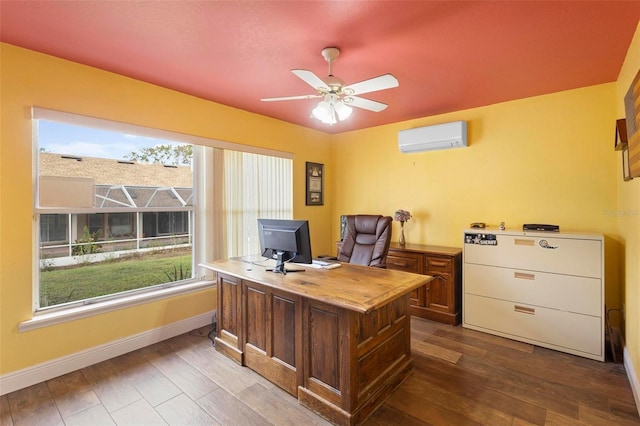 office featuring ceiling fan, wood-type flooring, and a wall mounted AC