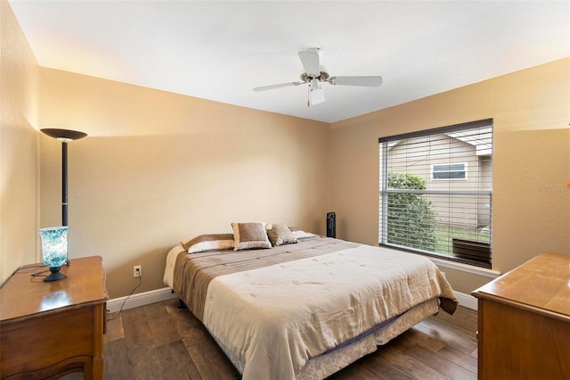 bedroom featuring ceiling fan and dark wood-type flooring