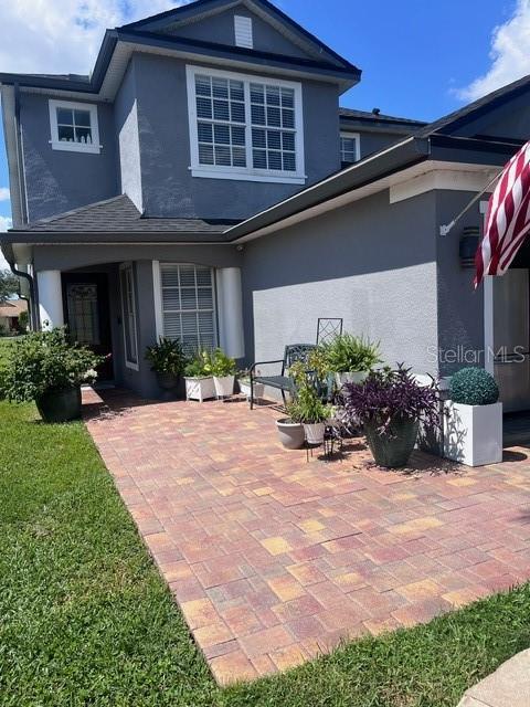 rear view of house featuring a patio area