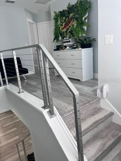 stairs with wood-type flooring