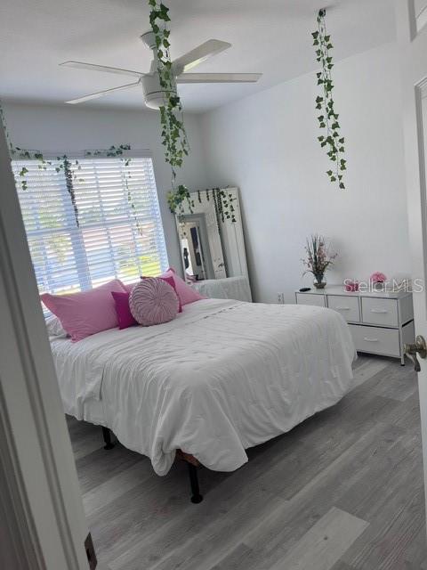 bedroom featuring ceiling fan and hardwood / wood-style floors