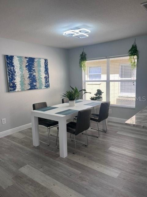 dining room with hardwood / wood-style floors