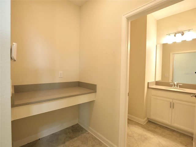 bathroom with tile patterned floors and vanity