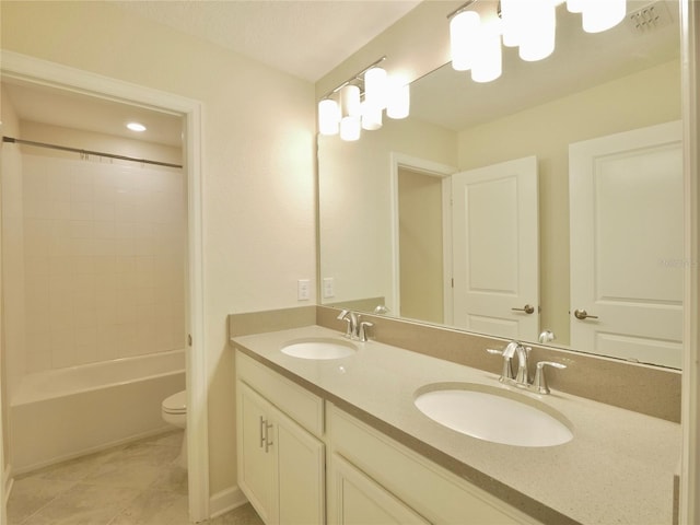 full bathroom with tile patterned flooring, vanity, toilet, and tiled shower / bath combo